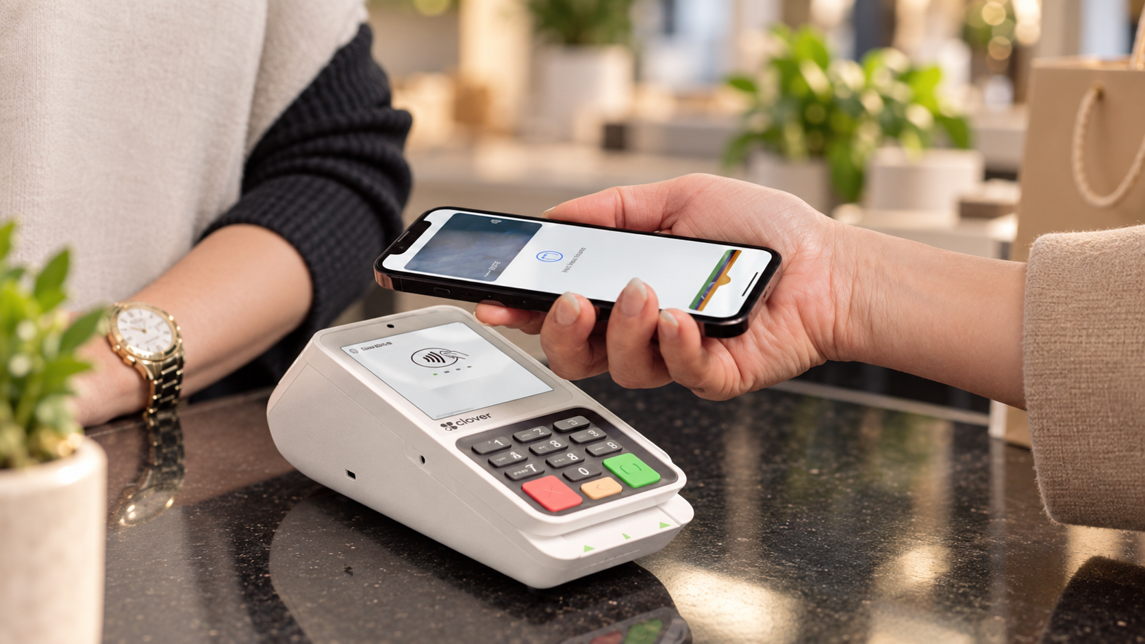 Clover Compact countertop terminal accepting a contactless phone payment